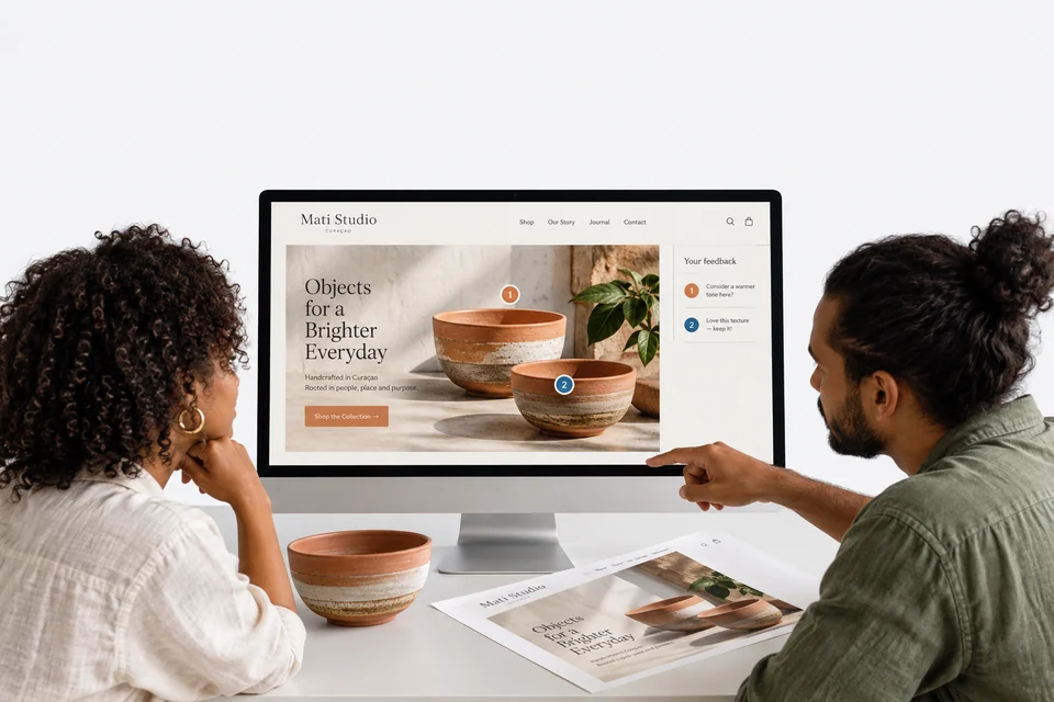 Mati Studio website design on a desktop monitor with feedback markers and a printed proof.